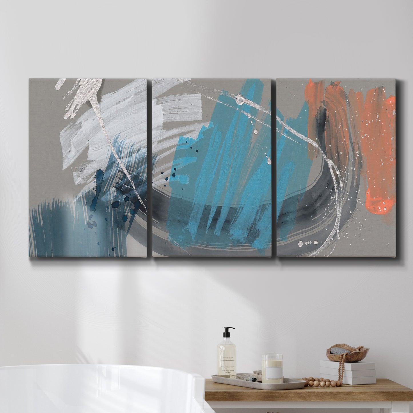 Three-panel canvas wall art featuring playful abstract mark making, displayed in a bathroom above a bathtub.