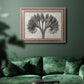 Vintage botanical plant study photograph by Karl Blossfeldt in an ornate traditional silver frame displayed in a dark-toned interior setting.