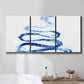 Three-panel canvas wall art featuring indigo abstract vapor watercolor, displayed in a bathroom above a bathtub.