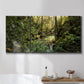 Three-panel canvas wall art featuring sun filtered woodland photograph, displayed in a bathroom above a bathtub.
