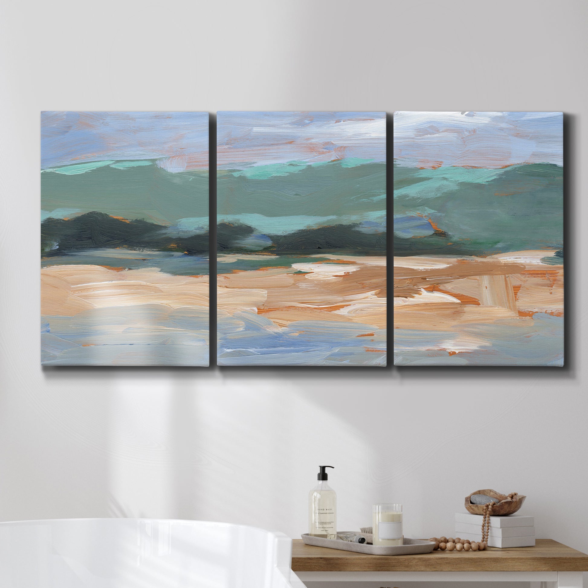Three-panel canvas wall art featuring abstract landscape composition study, displayed in a bathroom above a bathtub.