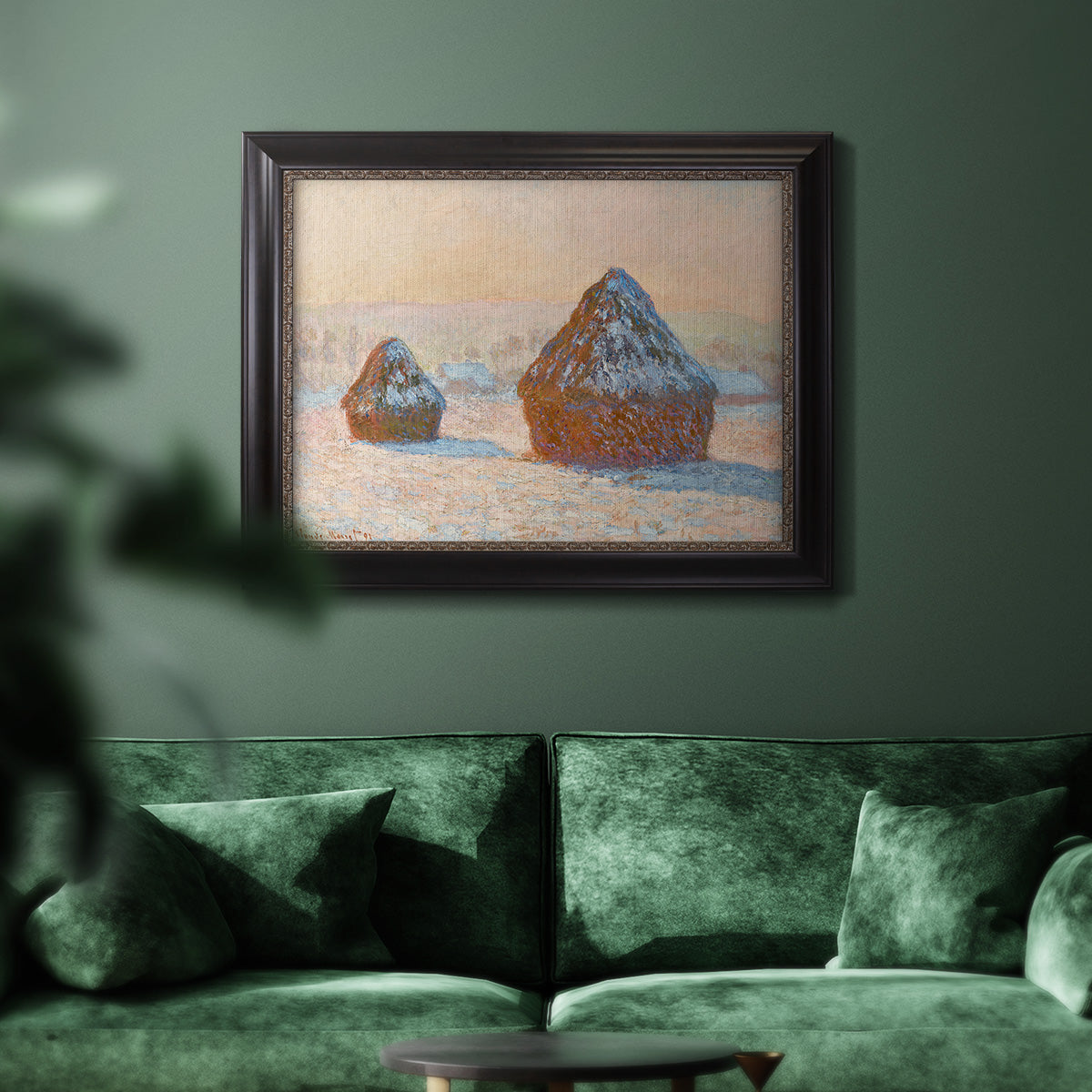 Impressionist winter haystack scene by Claude Monet in an ornate black frame with gilded inner detail displayed in a dark-toned interior setting.