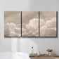 Three-panel canvas wall art featuring soft whimsical cloudscape, displayed in a bathroom above a bathtub.