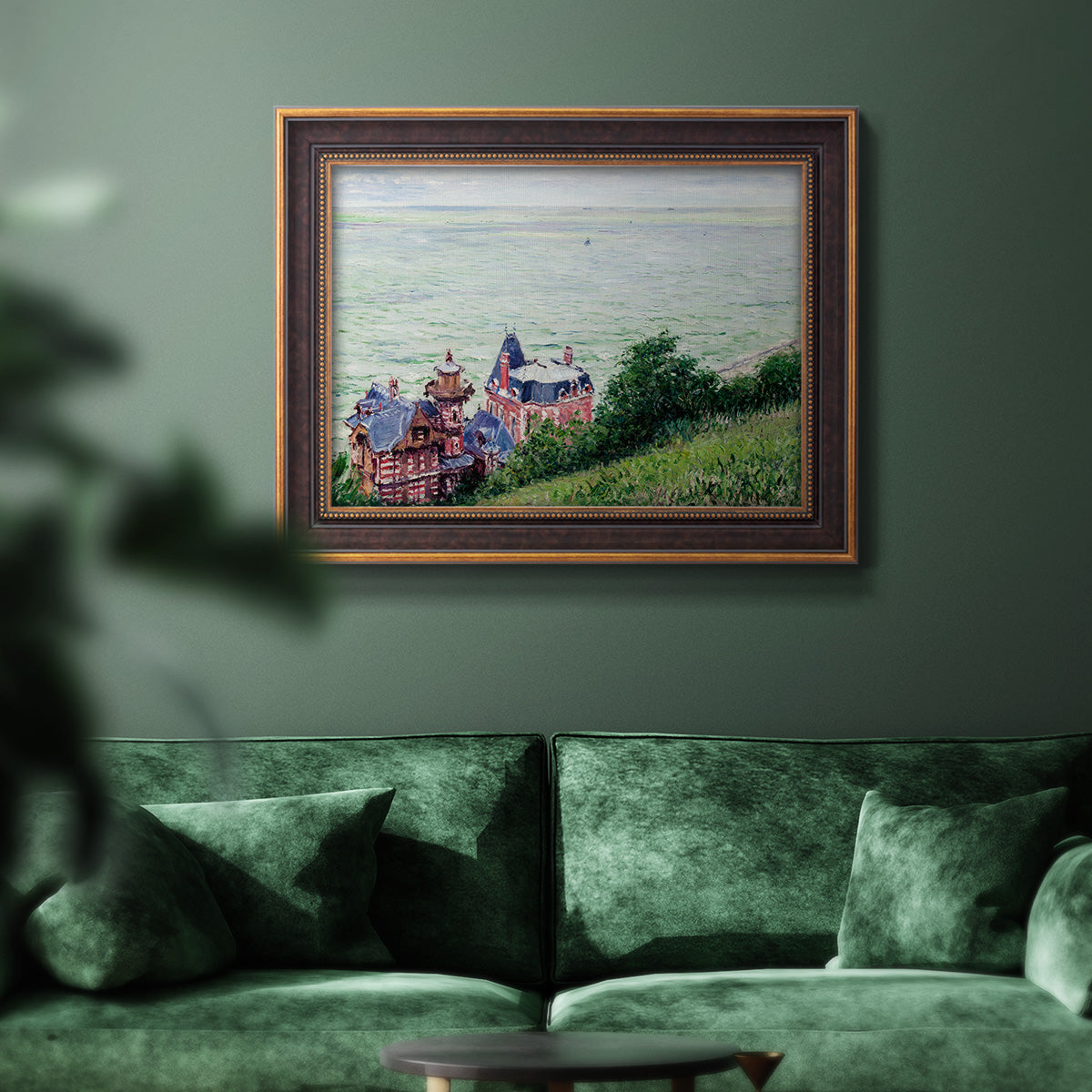 Impressionist coastal villas landscape by Gustave Caillebotte in an ornate bronzed mahogany wood frame displayed in a dark-toned interior setting.