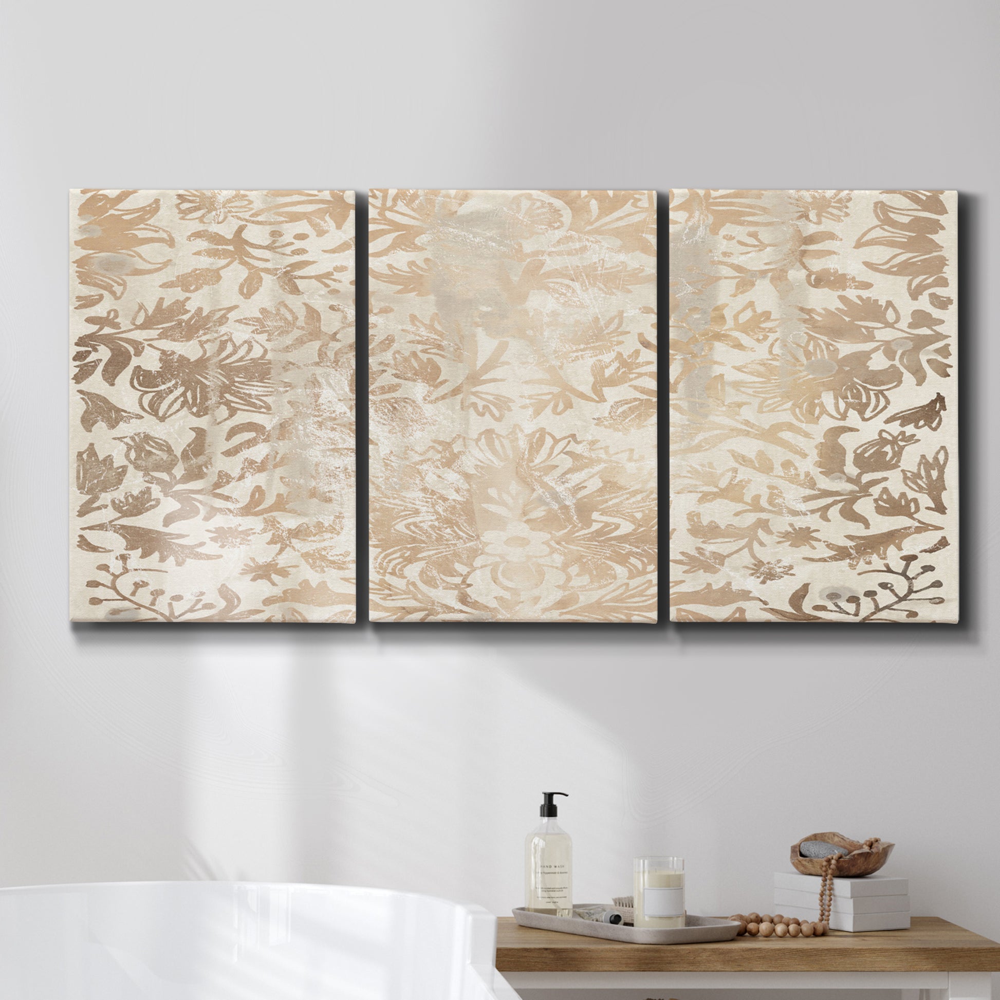 Three-panel canvas wall art featuring ornamental damask abstract pattern, displayed in a bathroom above a bathtub.