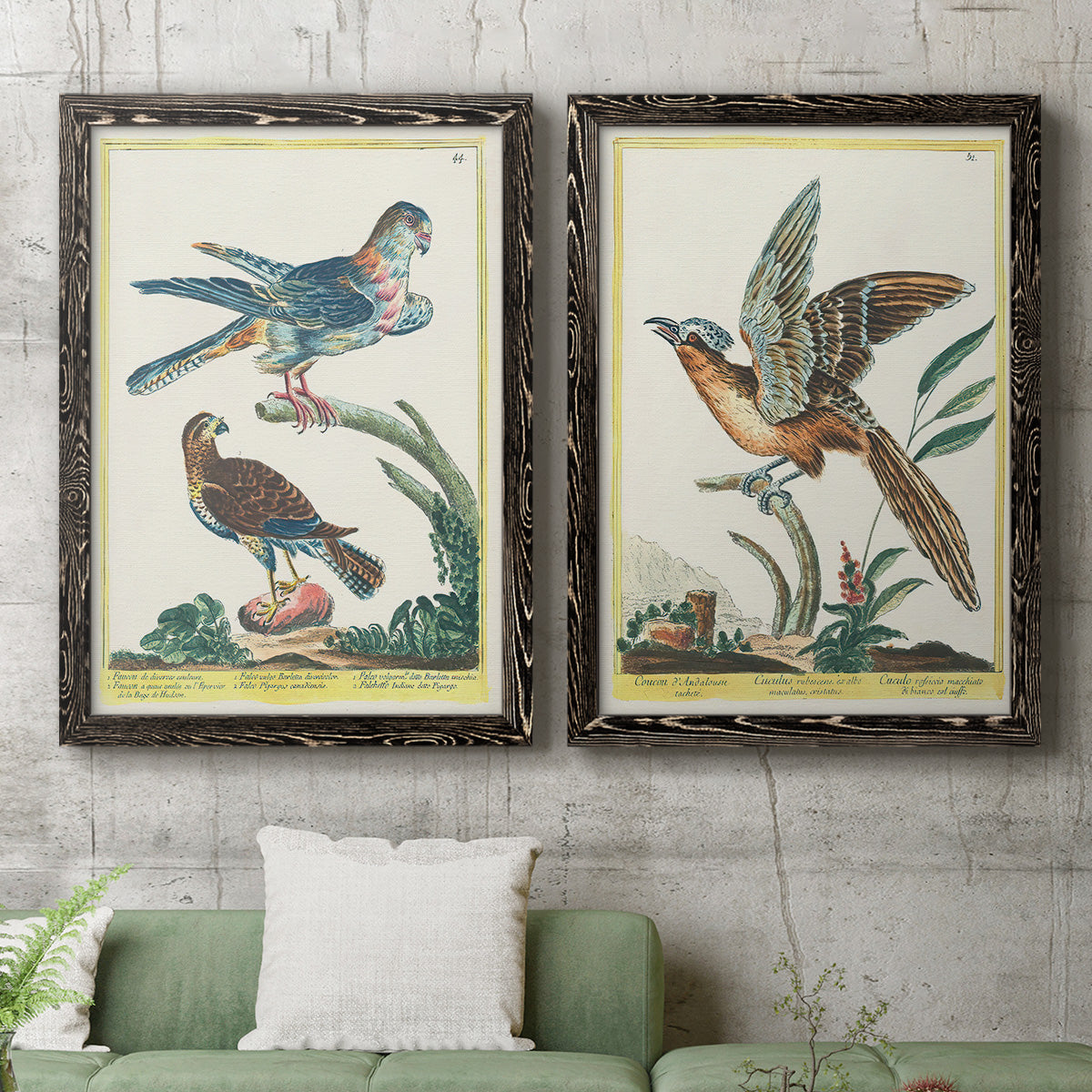 Set of two black barnwood framed canvas prints depicting a coordinated art pair of misty blue gray and violet marks hovering across pale grounds rendered as atmospheric abstract paintings above a sofa in a modern living room.