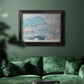 Impressionist coastal village landscape in Norway by Claude Monet in an ornate black frame with gilded inner detail displayed in a dark-toned interior setting.