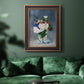 Impressionist floral still life painting by Claude Monet in an ornate bronzed mahogany wood frame displayed in a dark-toned interior setting.