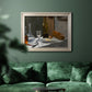 Impressionist still life with wine and bread by Claude Monet in an ornate champagne frame displayed in a dark-toned interior setting.