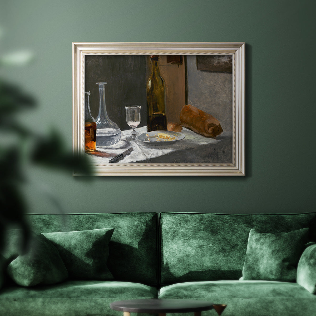 Impressionist still life with wine and bread by Claude Monet in an ornate champagne frame displayed in a dark-toned interior setting.