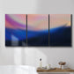 Three-panel canvas wall art featuring smooth abstract sunset color gradient, displayed in a bathroom above a bathtub.