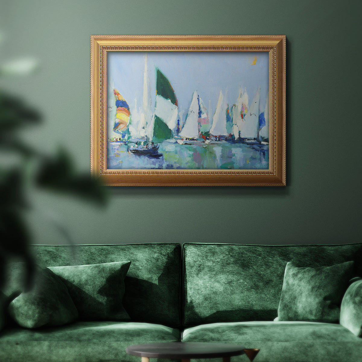 Coastal harbor watercolor painting in an ornate antique gold frame displayed in a dark-toned interior setting.