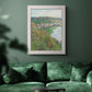 Impressionist landscape view of Vétheuil by Claude Monet in an ornate weathered white frame displayed in a dark-toned interior setting.