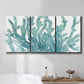 Three-panel canvas wall art featuring blue coral inspired watercolor, displayed in a bathroom above a bathtub.