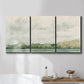 Three-panel canvas wall art featuring riverbank landscape with trees, displayed in a bathroom above a bathtub.