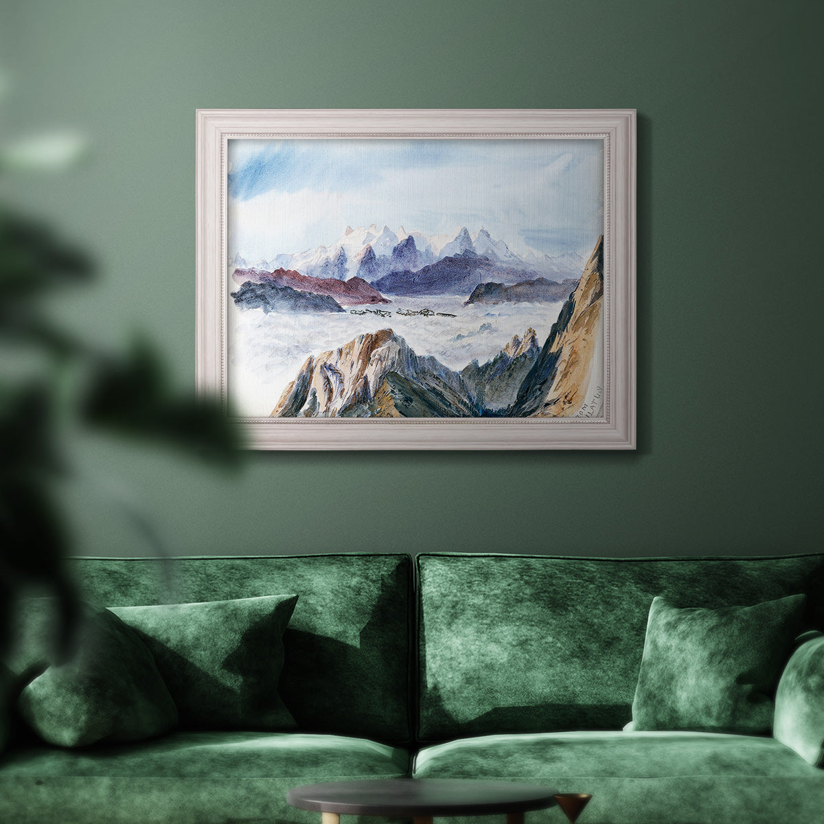 Impressionist alpine mountain landscape by John Singer Sargent in an ornate weathered white frame displayed in a dark-toned interior setting.