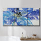 Three-panel canvas wall art featuring blue floral botanical close up, displayed in a bathroom above a bathtub.