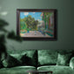 Impressionist residential landscape at Argenteuil by Claude Monet in an ornate black frame with gilded inner detail displayed in a dark-toned interior setting.