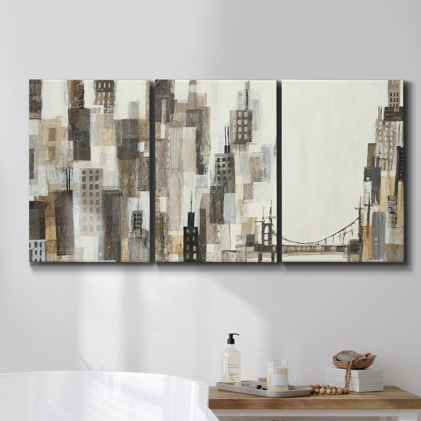 Three-panel canvas wall art featuring abstract harbor inspired composition, displayed in a bathroom above a bathtub.