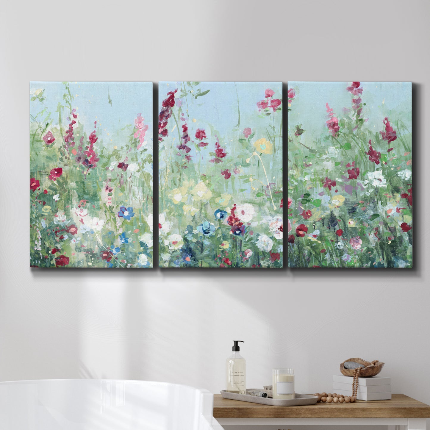 Three-panel canvas wall art featuring night landscape silhouette photography, displayed in a bathroom above a bathtub.