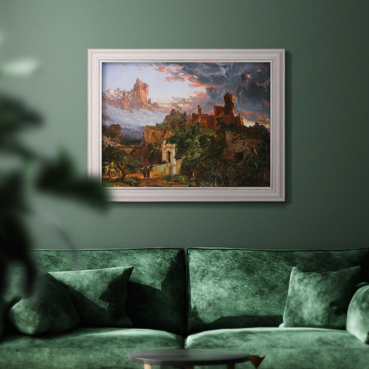 Romantic allegorical landscape painting by Jasper Francis Cropsey in an ornate weathered white frame displayed in a dark-toned interior setting.