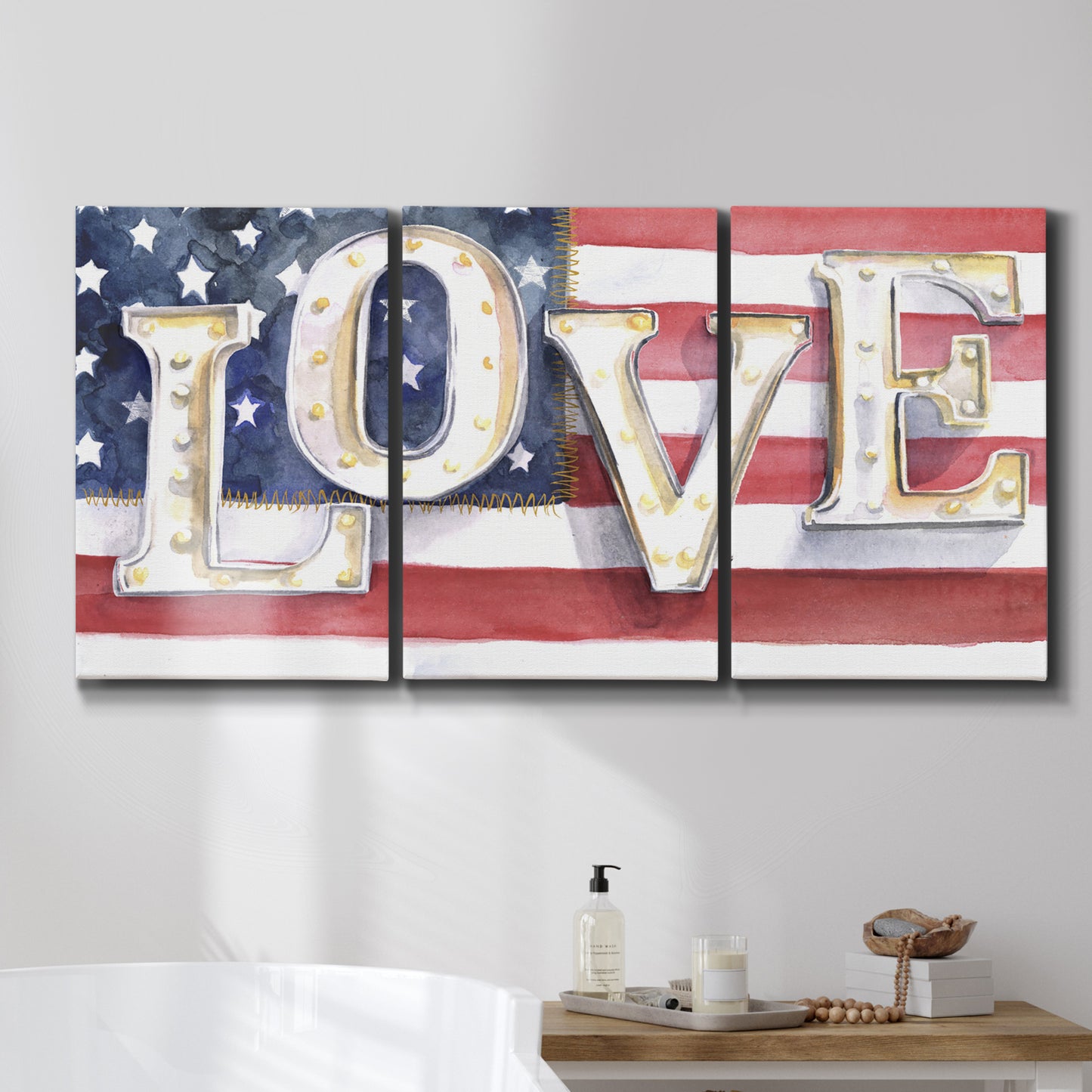Three-panel canvas wall art featuring patriotic rustic typography art, displayed in a bathroom above a bathtub.