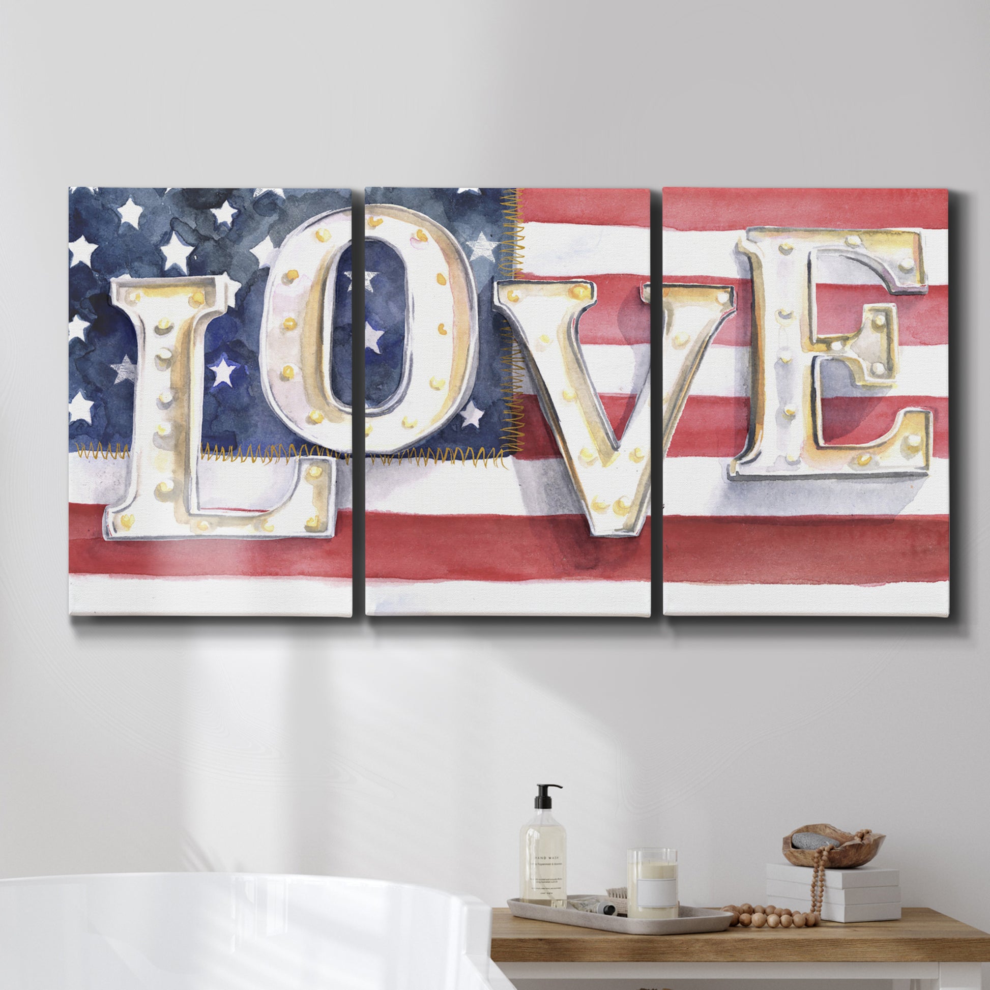 Three-panel canvas wall art featuring patriotic rustic typography art, displayed in a bathroom above a bathtub.