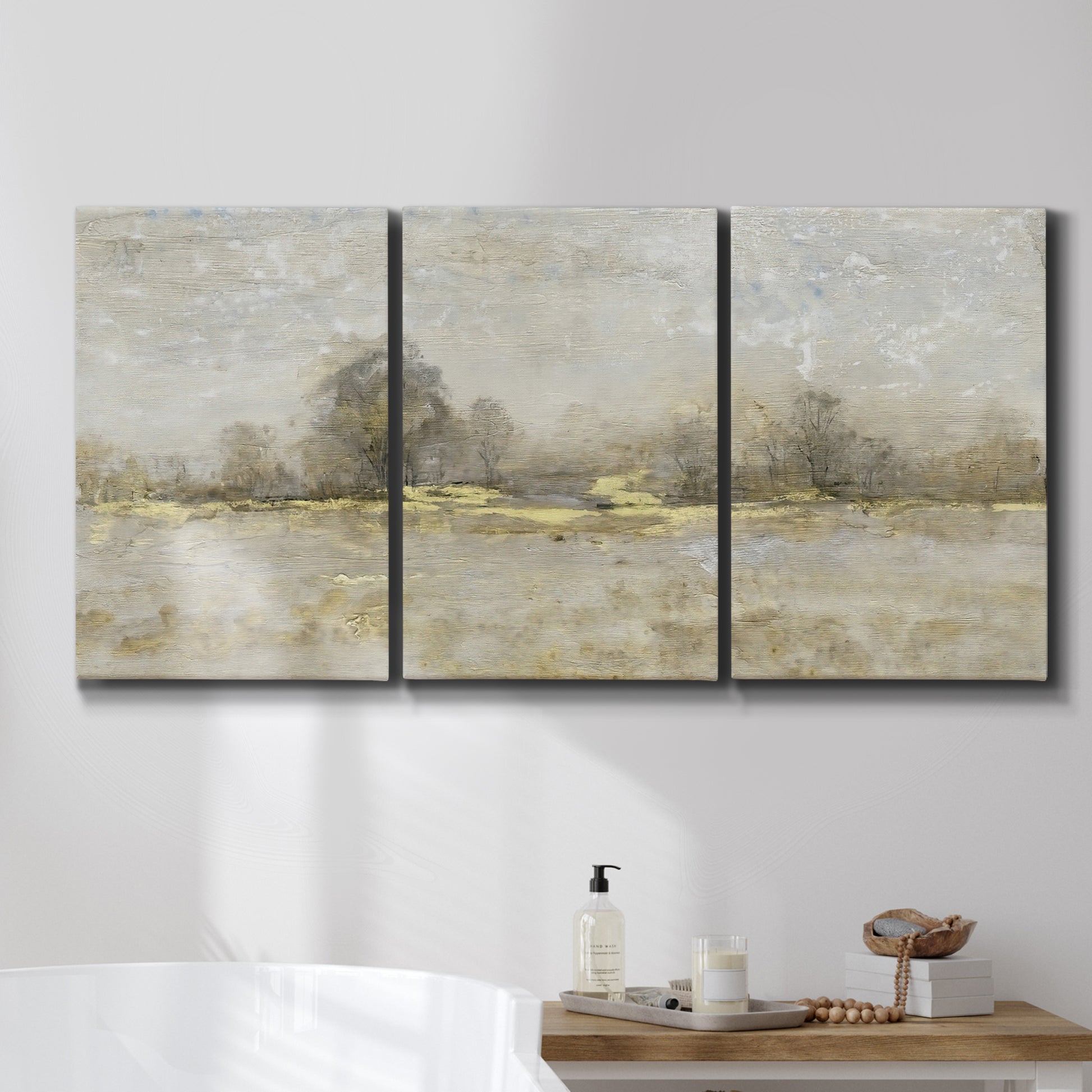 Three-panel canvas wall art featuring late season rural harvest fields, displayed in a bathroom above a bathtub.