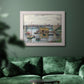 Impressionist river bridge scene on an overcast day by Claude Monet in an ornate weathered white frame displayed in a dark-toned interior setting.