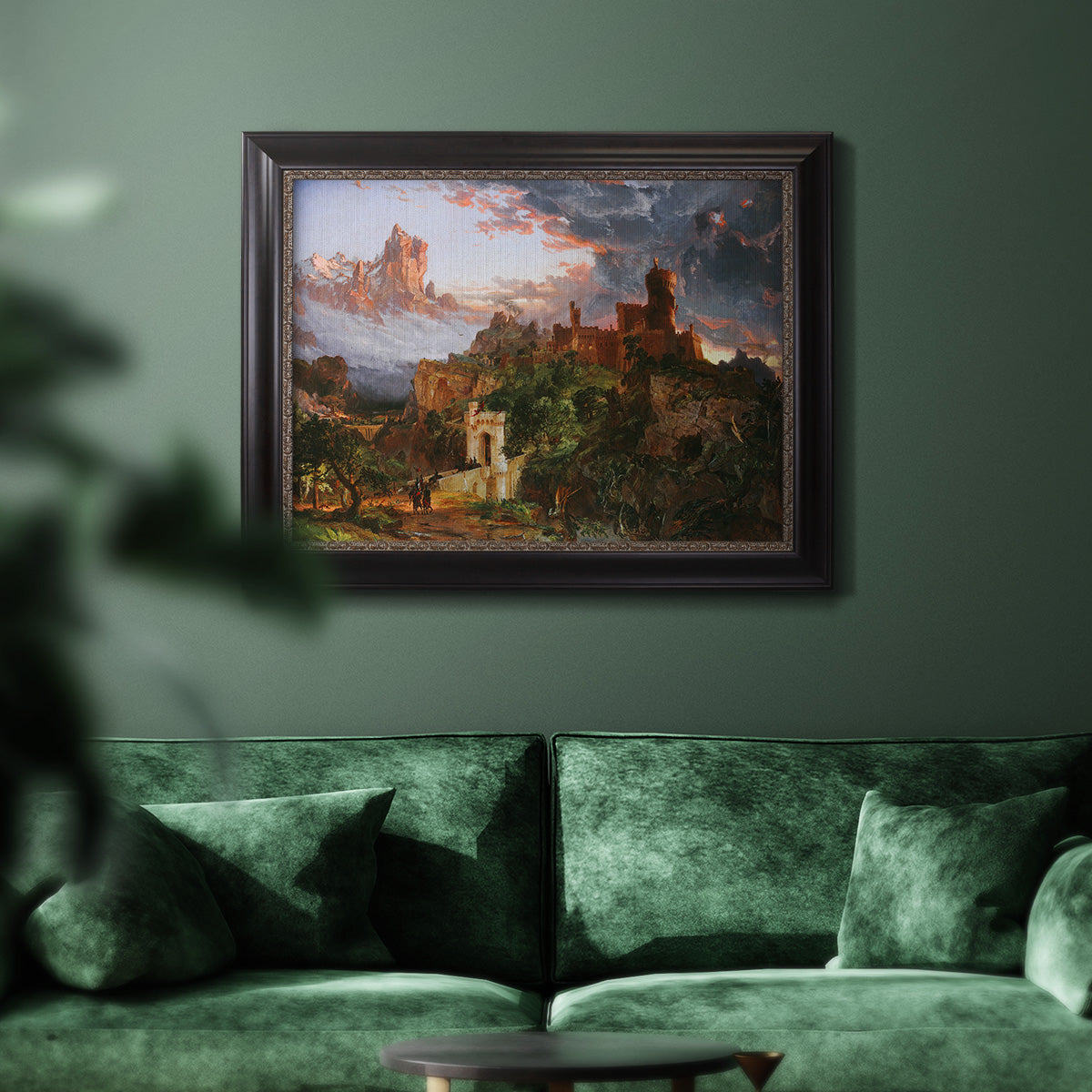 Romantic allegorical landscape painting by Jasper Francis Cropsey in an ornate black frame with gilded inner detail displayed in a dark-toned interior setting.