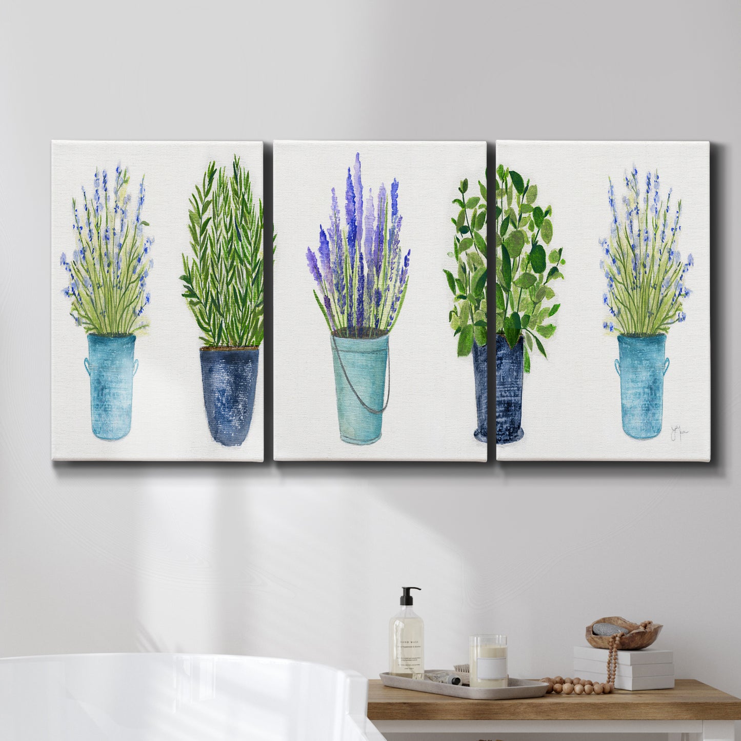 Three-panel canvas wall art featuring minimal monochrome abstract forms, displayed in a bathroom above a bathtub.
