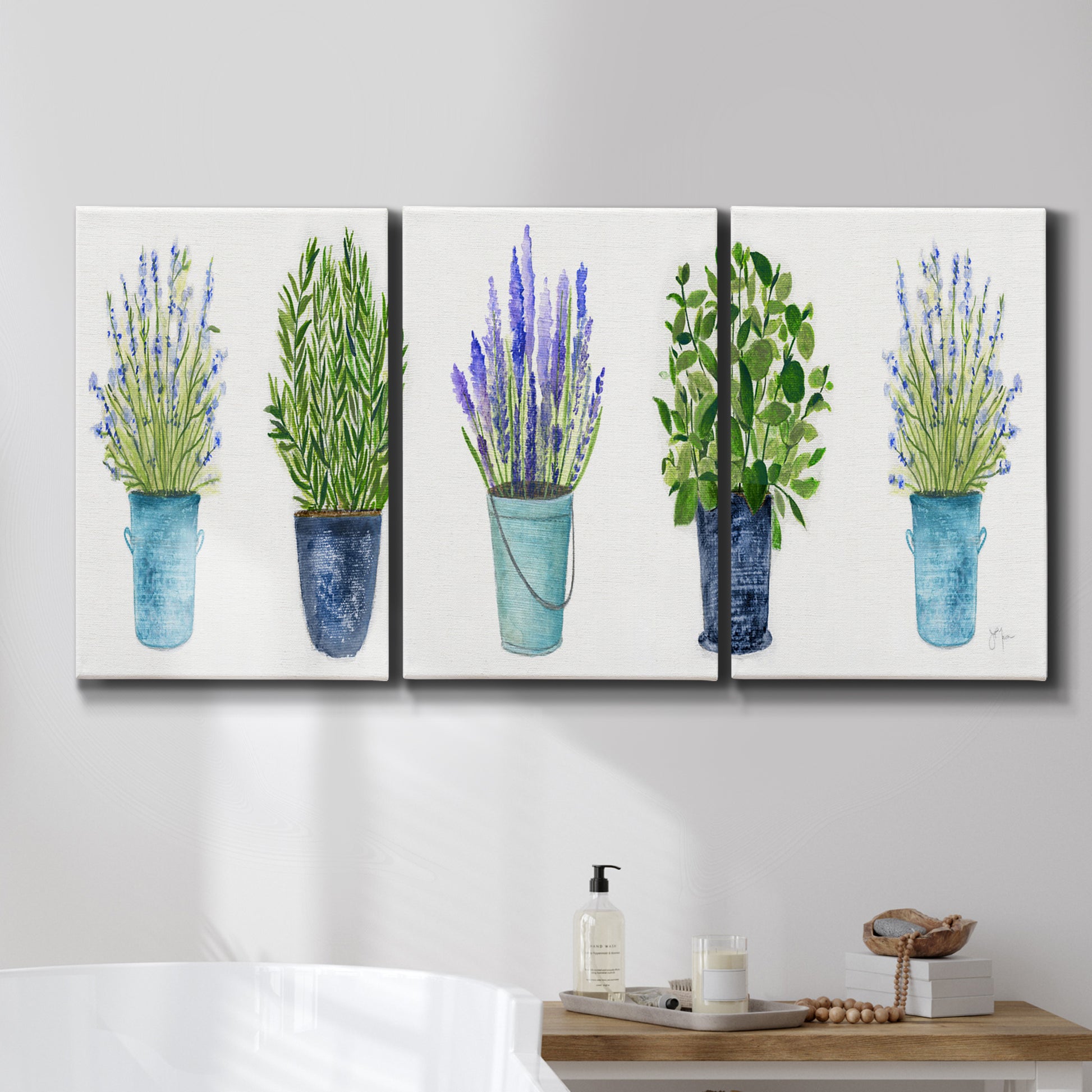 Three-panel canvas wall art featuring minimal monochrome abstract forms, displayed in a bathroom above a bathtub.