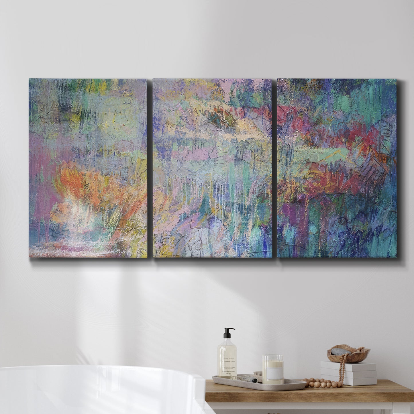Three-panel canvas wall art featuring abstract evening landscape with depth, displayed in a bathroom above a bathtub.