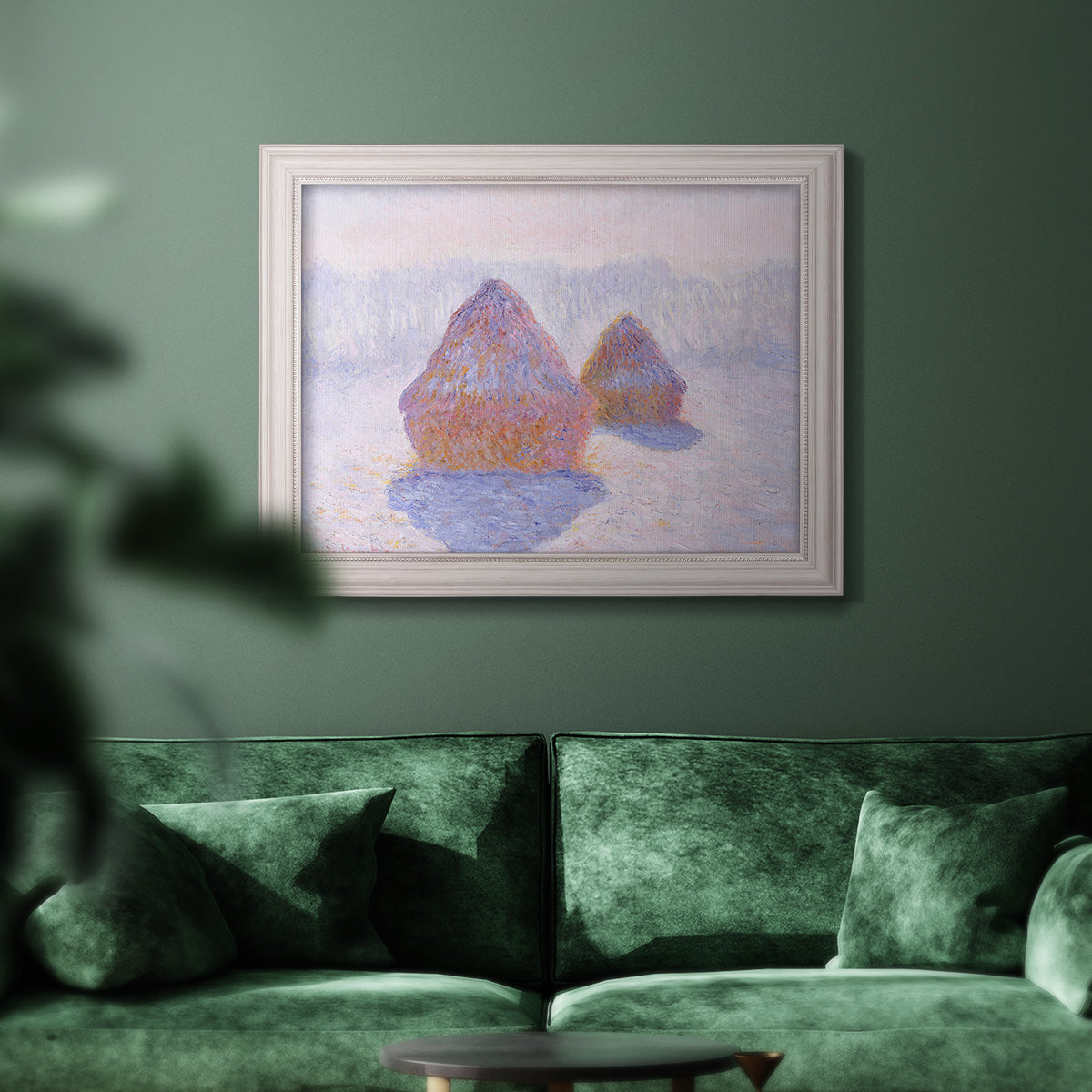 Impressionist winter haystack scene with sunlight by Claude Monet in an ornate weathered white frame displayed in a dark-toned interior setting.