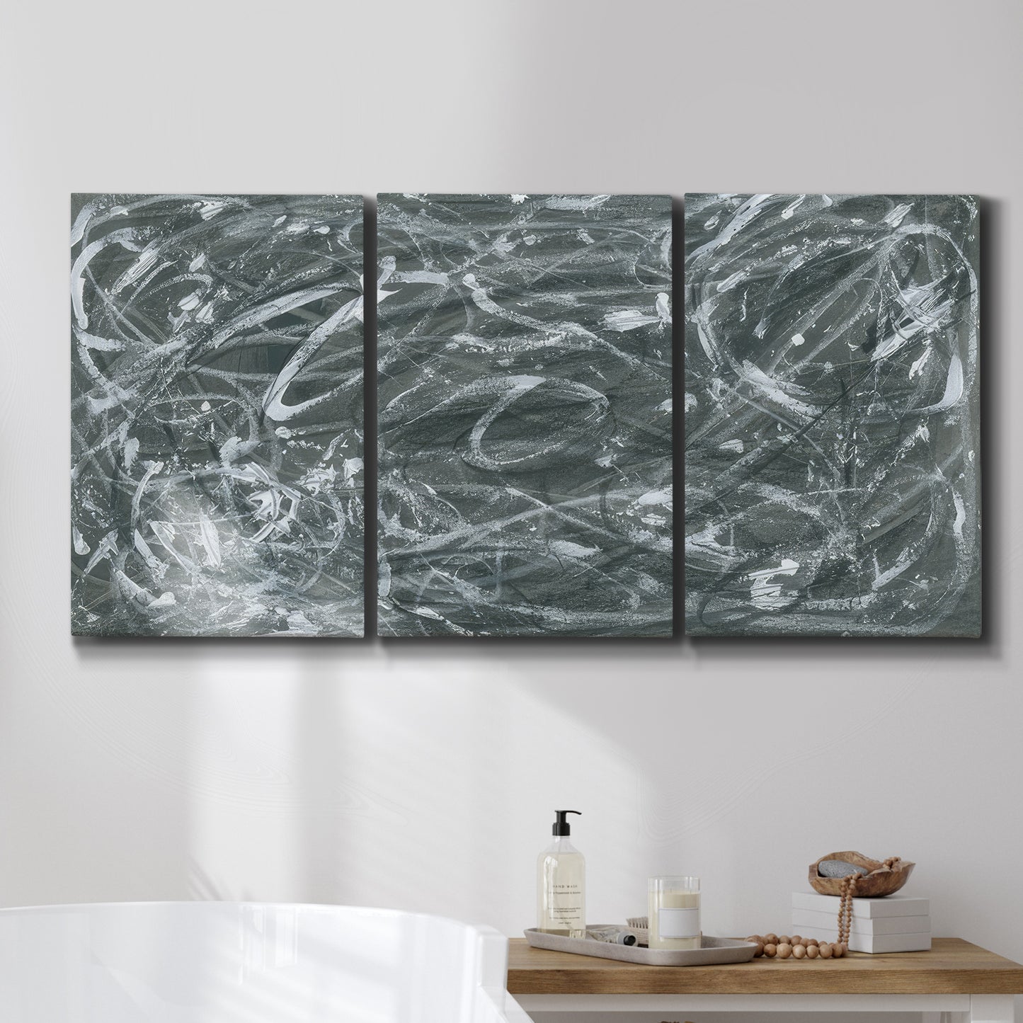 Three-panel canvas wall art featuring abstract view through window forms, displayed in a bathroom above a bathtub.