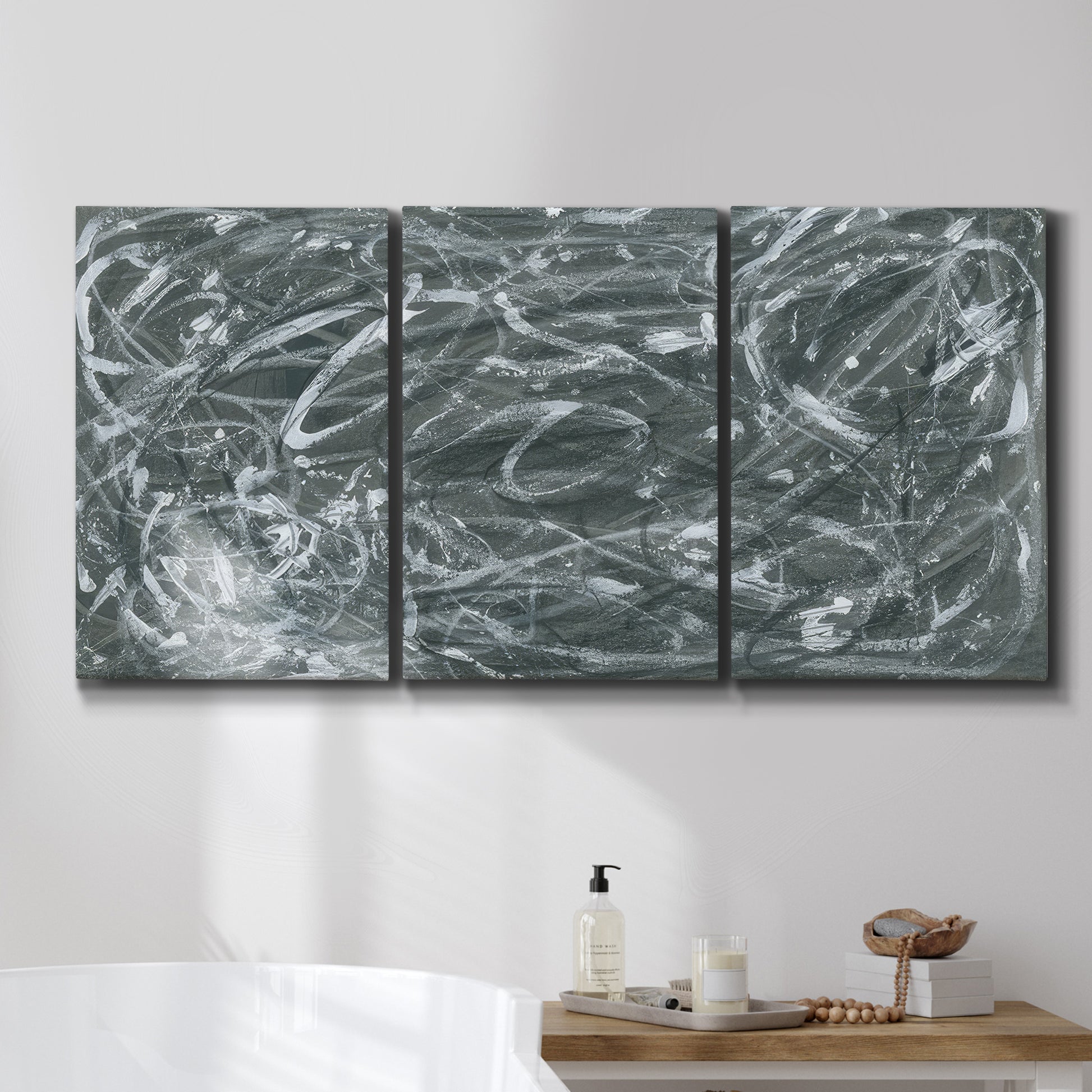 Three-panel canvas wall art featuring abstract view through window forms, displayed in a bathroom above a bathtub.