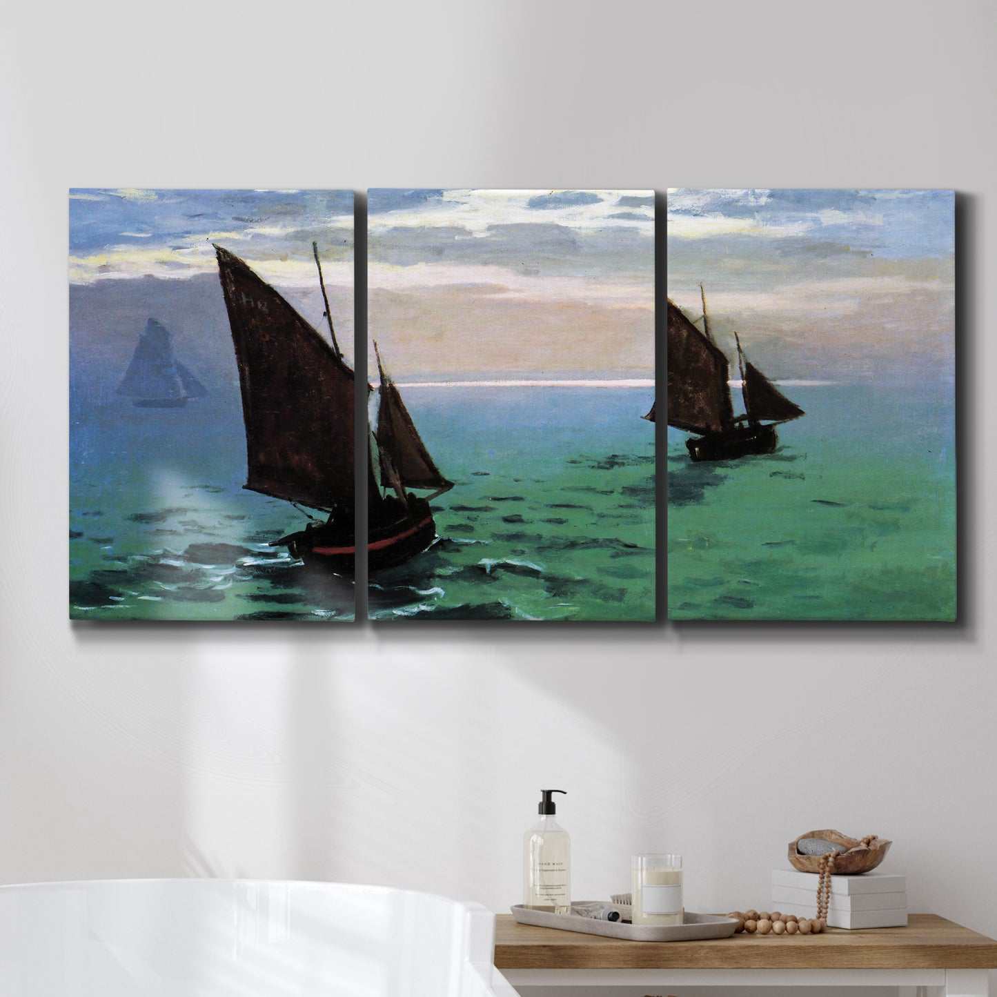 Three-panel canvas wall art featuring fishing boats moving through open sea, displayed in a bathroom above a bathtub.