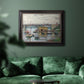 Impressionist river bridge scene on an overcast day by Claude Monet in an ornate black frame with gilded inner detail displayed in a dark-toned interior setting.