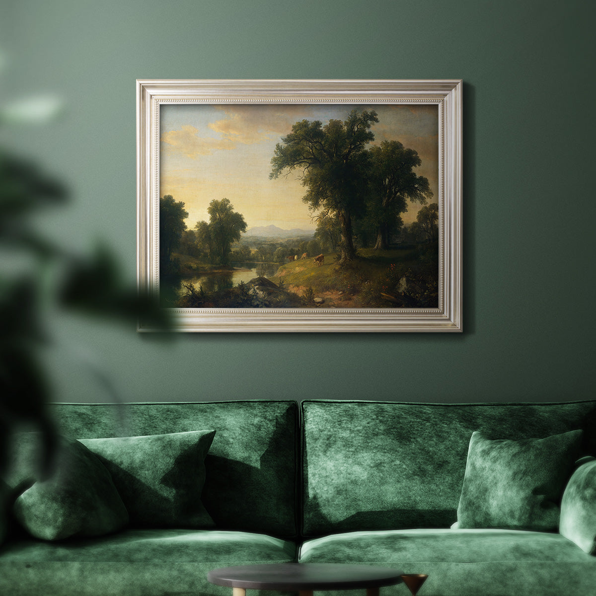 Traditional pastoral landscape painting by Asher Brown Durand in an ornate champagne frame displayed in a dark-toned interior setting.