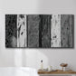 Three-panel canvas wall art featuring brushed metallic abstract textures, displayed in a bathroom above a bathtub.