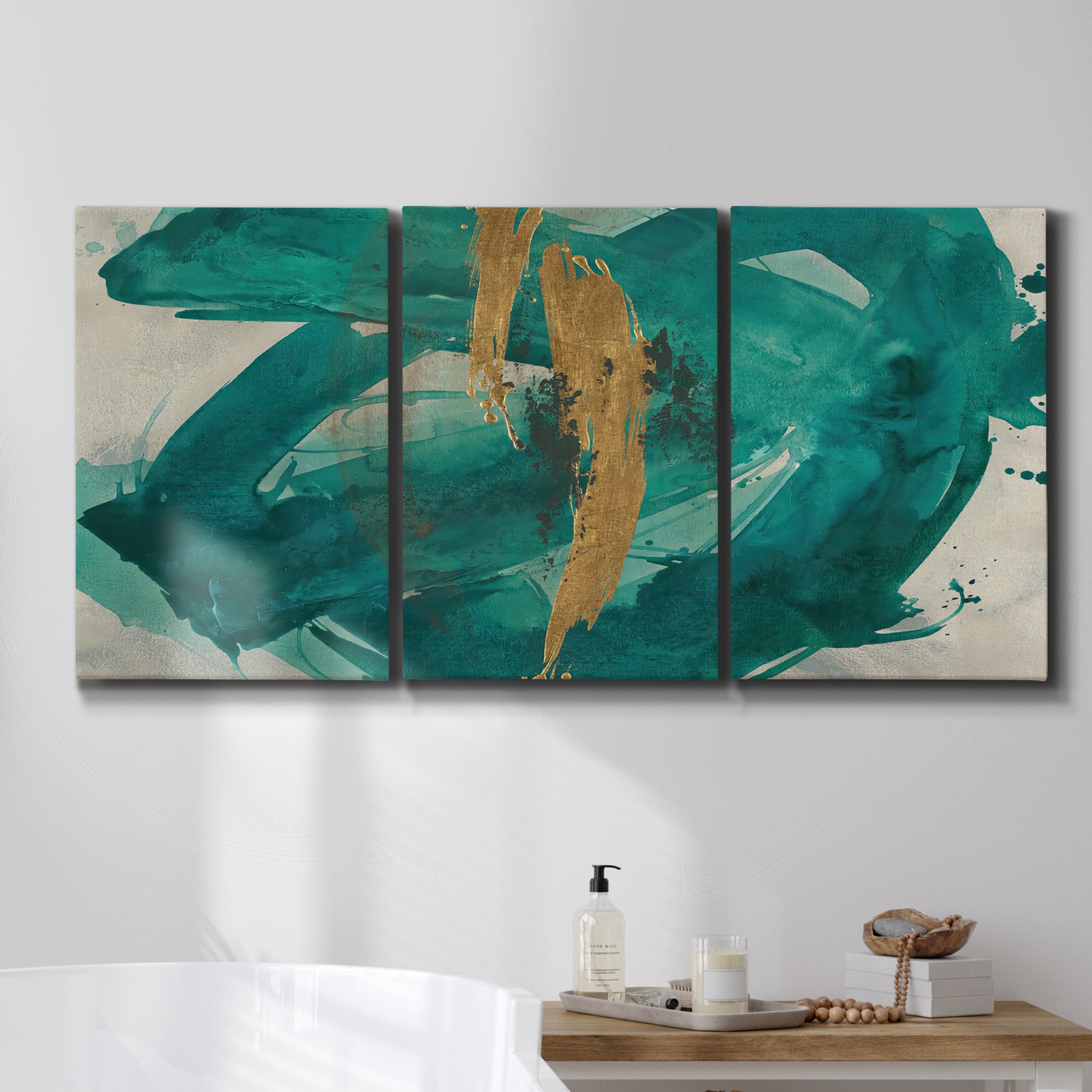 Three-panel canvas wall art featuring interconnected abstract flowing forms, displayed in a bathroom above a bathtub.