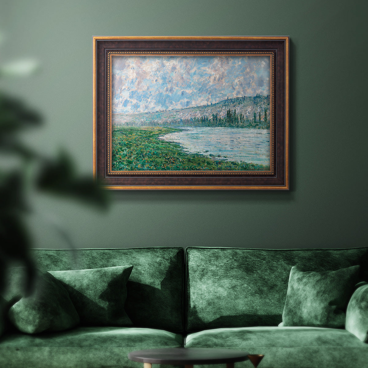 Impressionist river landscape at Vétheuil by Claude Monet in an ornate bronzed mahogany wood frame displayed in a dark-toned interior setting.