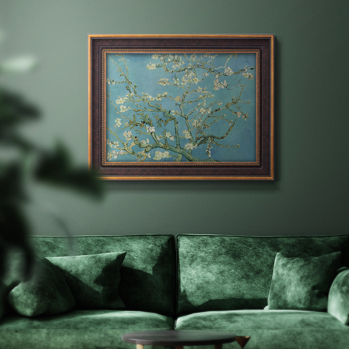 Impressionist flowering almond branch painting by Vincent van Gogh in an ornate bronzed mahogany wood frame displayed in a dark-toned interior setting.