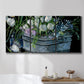 Three-panel canvas wall art featuring colorful wild tulips in bloom, displayed in a bathroom above a bathtub.