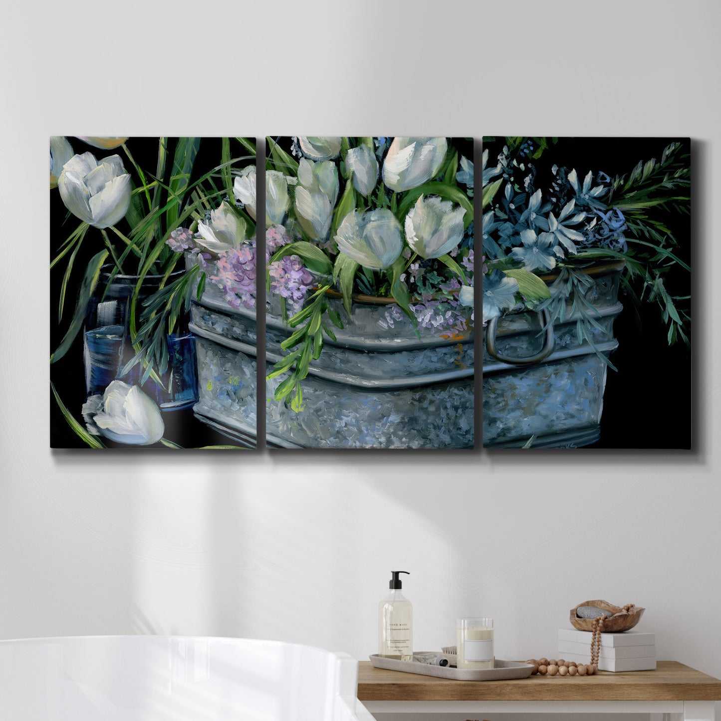 Three-panel canvas wall art featuring colorful wild tulips in bloom, displayed in a bathroom above a bathtub.