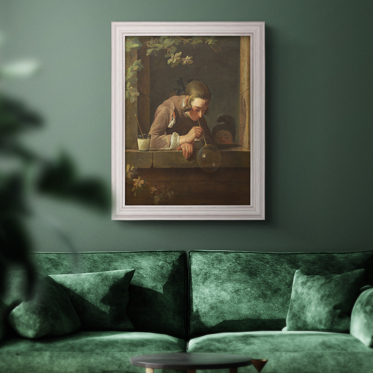 Classical genre painting of a child blowing soap bubbles by Jean-Siméon Chardin in an ornate weathered white frame displayed in a dark-toned interior setting.