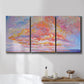 Three-panel canvas wall art featuring peaceful tropical inspired landscape, displayed in a bathroom above a bathtub.