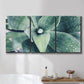 Three-panel canvas wall art featuring green succulent plant photograph, displayed in a bathroom above a bathtub.