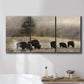 Three-panel canvas wall art featuring cattle grazing along ridge line, displayed in a bathroom above a bathtub.