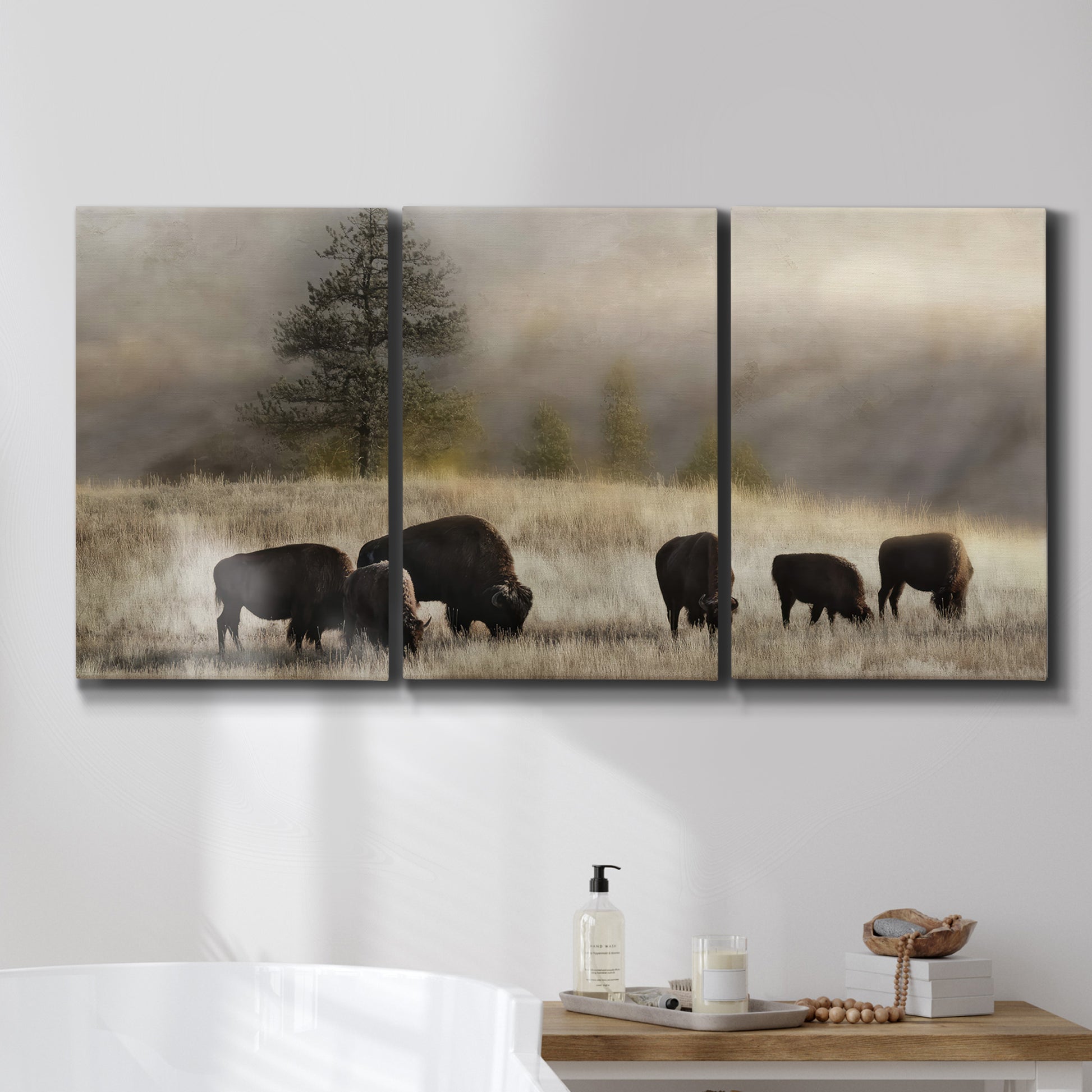 Three-panel canvas wall art featuring cattle grazing along ridge line, displayed in a bathroom above a bathtub.